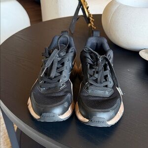 Reebok Black Sneakers with Gold Midsole Accents